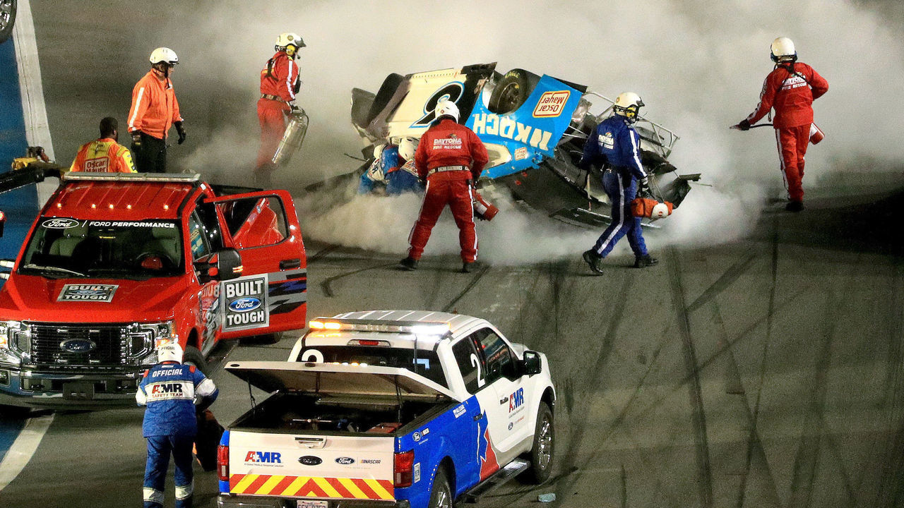 DAYTONA BEACH, FLORIDA - FEBRUARY 17: Track workers attend to Ryan Newman, driver of the #6 Koch Industries Ford, following a crash during the NASCAR Cup Series 62nd Annual Daytona 500 at Daytona International Speedway on February 17, 2020 in Daytona Beach, Florida.