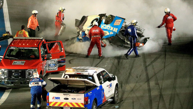 DAYTONA BEACH, FLORIDA - FEBRUARY 17: Track workers attend to Ryan Newman, driver of the #6 Koch Industries Ford, following a crash during the NASCAR Cup Series 62nd Annual Daytona 500 at Daytona International Speedway on February 17, 2020 in Daytona Beach, Florida.