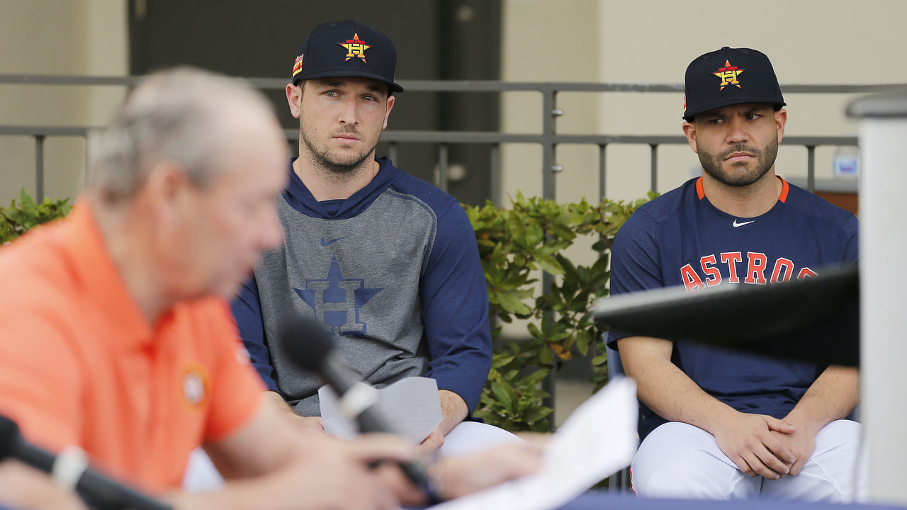 WEST PALM BEACH, FLORIDA - FEBRUARY 13: Alex Bregman #2 and Jose Altuve #27 of the Houston Astros look on as owner Jim Crane reads a prepared statement during a press conference at FITTEAM Ballpark of The Palm Beaches on February 13, 2020 in West Palm Beach, Florida.