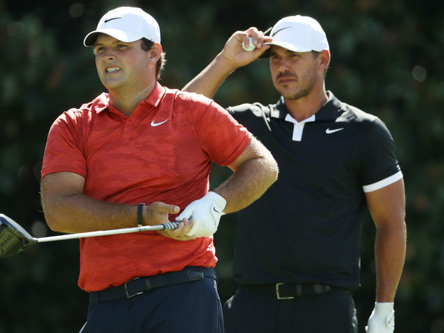 ATLANTA, GEORGIA - AUGUST 22: Patrick Reed of the United States and Brooks Koepka of the United States look on from the 14th tee during the first round of the TOUR Championship at East Lake Golf Club on August 22, 2019 in Atlanta, Georgia.