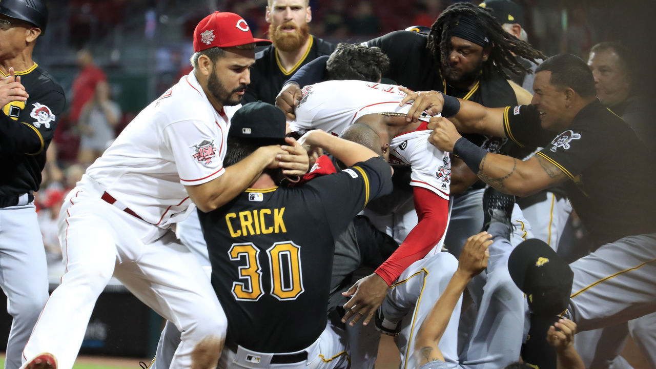CINCINNATI, OHIO - JULY 30: Amir Garrett #50 (middle white shirt with out hat) of the Cincinnati Reds engages members of the Pittsburgh Pirates during a bench clearing altercation in the 9th inning of the game at Great American Ball Park on July 30, 2019 in Cincinnati, Ohio.