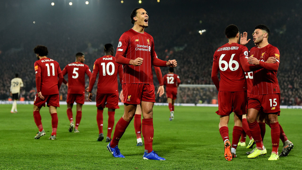 LIVERPOOL, ENGLAND - JANUARY 19: (THE SUN OUT, THE SUN ON SUNDAY OUT) Virgil van Dijk of Liverpool celebrates after scoring the opening goal during the Premier League match between Liverpool FC and Manchester United at Anfield on January 19, 2020 in Liverpool, United Kingdom.
