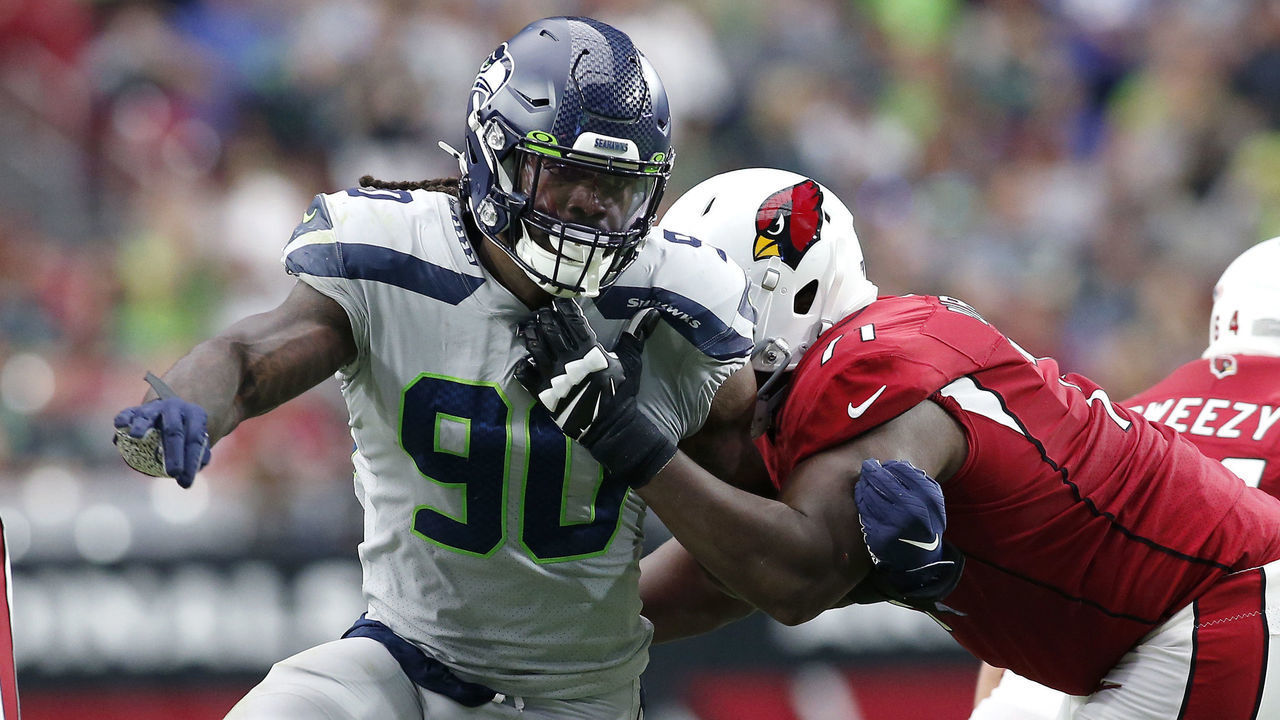GLENDALE, ARIZONA - SEPTEMBER 29: Defensive end Jadeveon Clowney #90 of the Seattle Seahawks battles through the block of offensive lineman Justin Murray #71 of the Arizona Cardinals during the second half of the NFL football game at State Farm Stadium on September 29, 2019 in Glendale, Arizona.