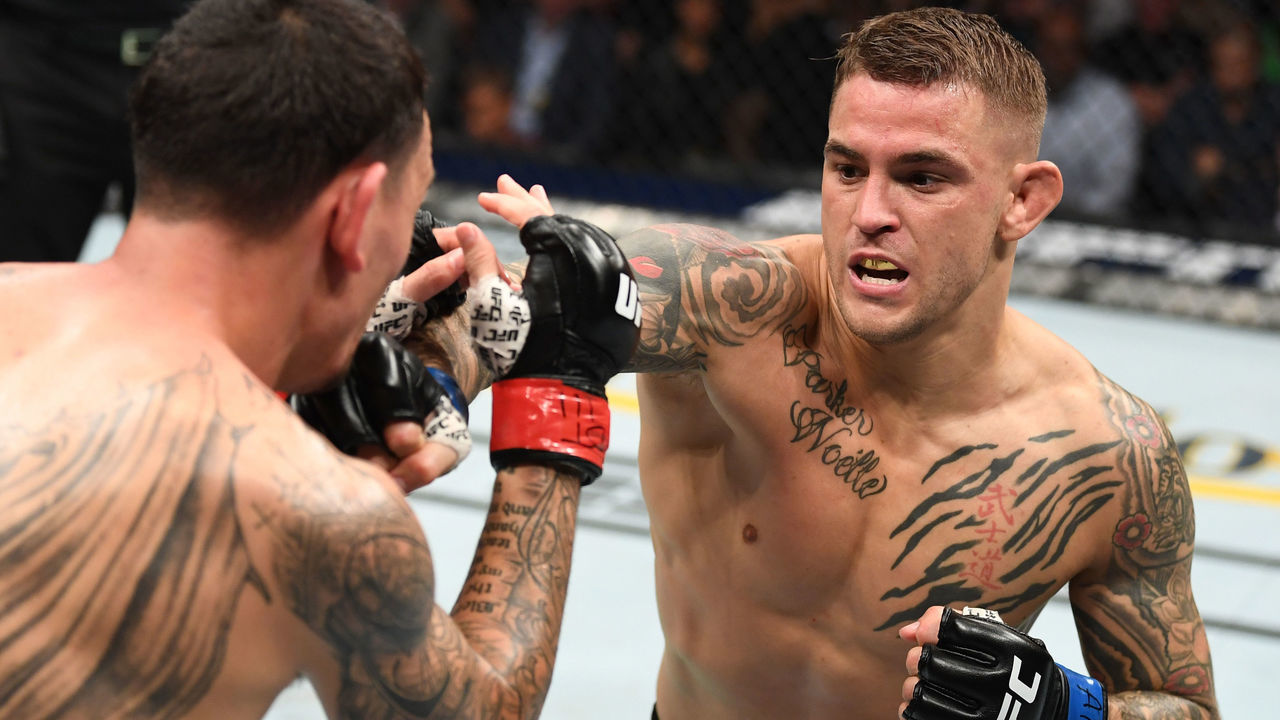 ATLANTA, GA - APRIL 13: (R-L) Dustin Poirier punches Max Holloway in their interim lightweight championship bout during the UFC 236 event at State Farm Arena on April 13, 2019 in Atlanta, Georgia.