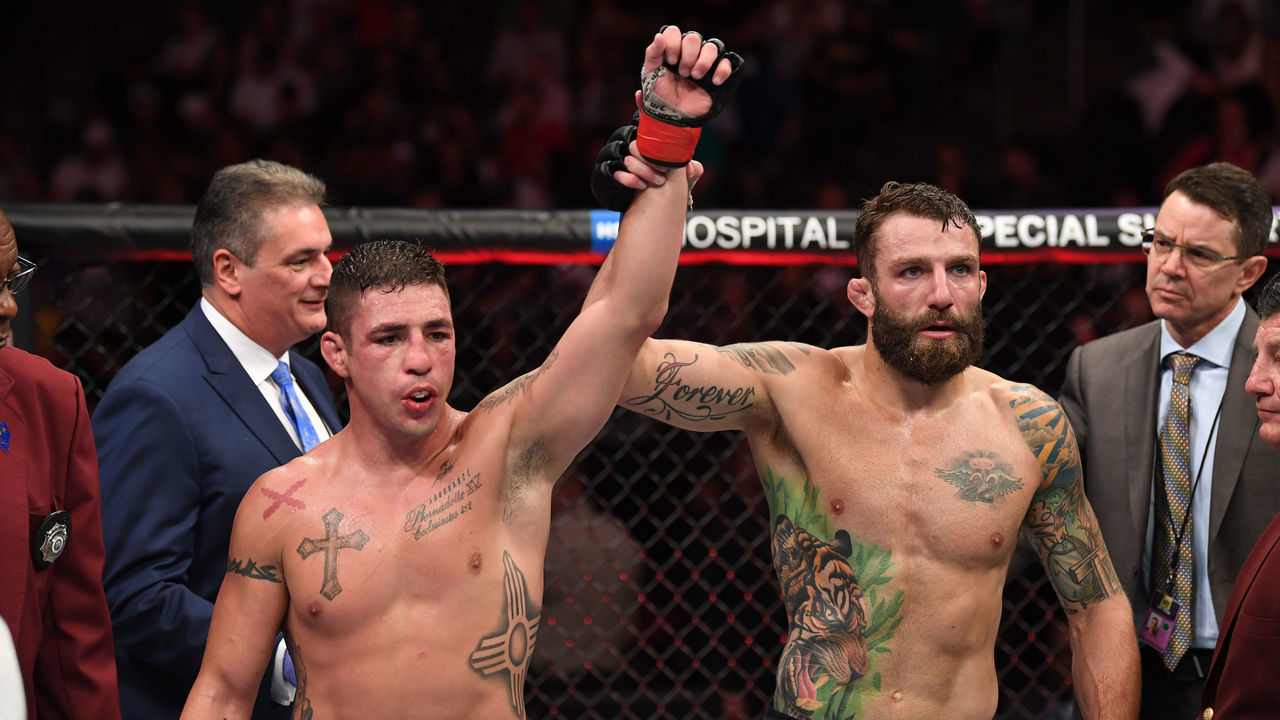 LAS VEGAS, NV - JULY 06: Michael Chiesa raises the hnad of Diego Sanchez in their welterweight fight during the UFC 239 event at T-Mobile Arena on July 6, 2019 in Las Vegas, Nevada.