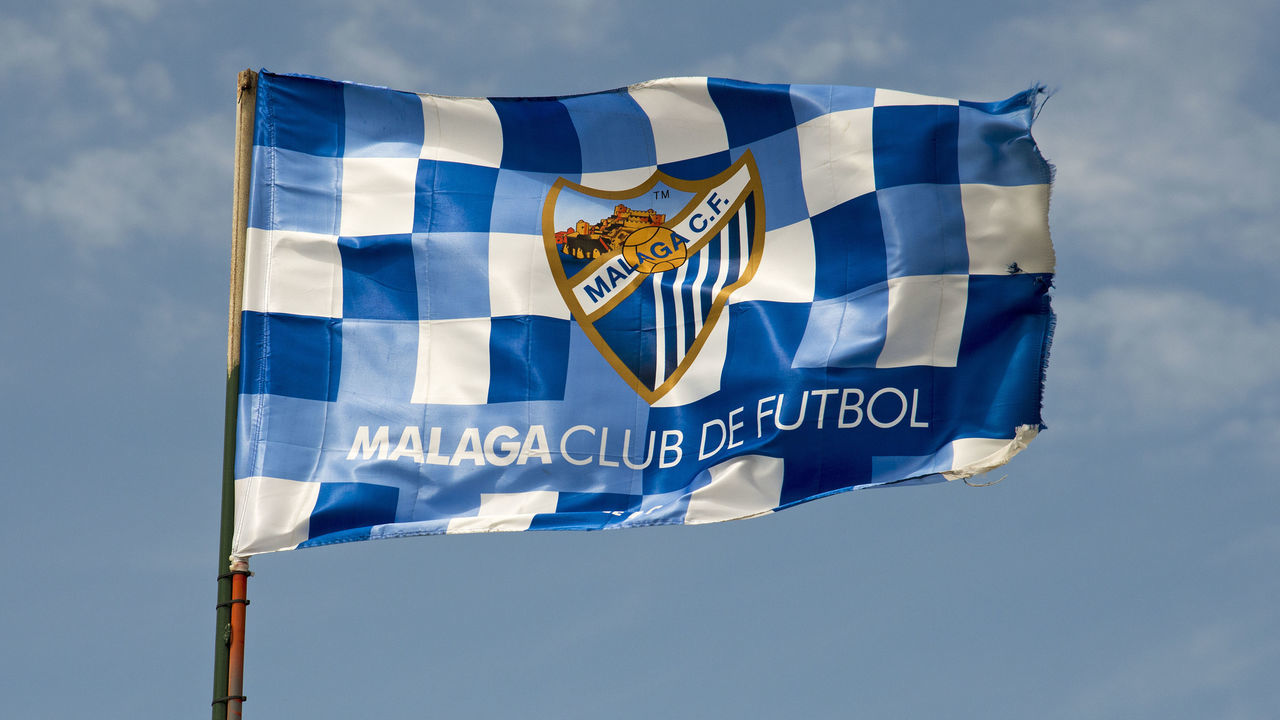 Malaga CF soccer club flag flying from a post Spanish football team. (Photo by: Education Images/Universal Images Group via Getty Images)