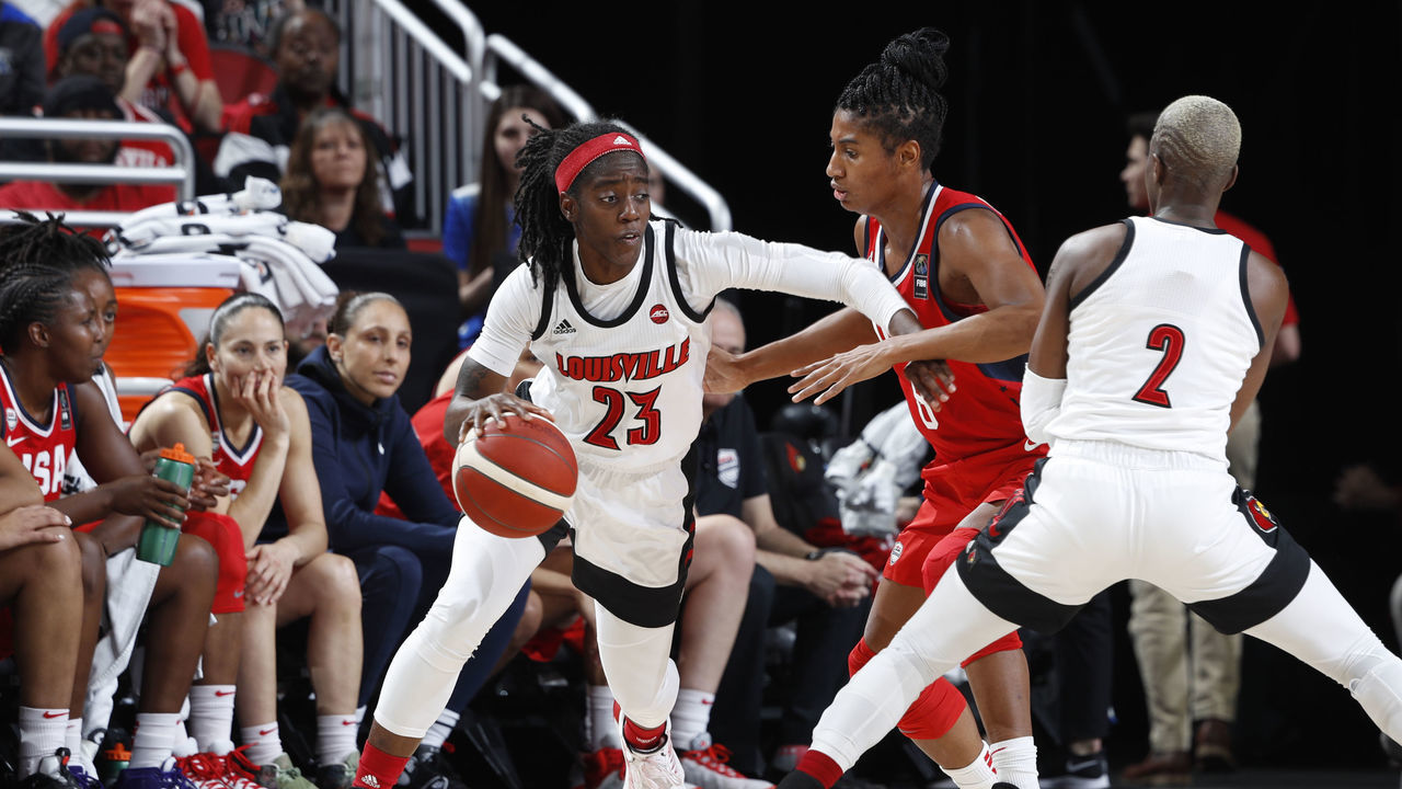 LOUISVILLE, KY - FEBRUARY 02: Jazmine Jones #23 of the Louisville Cardinals handles the basketball during an exhibition game against the USA Women's National team at KFC YUM! Center on February 2, 2020 in Louisville, Kentucky.