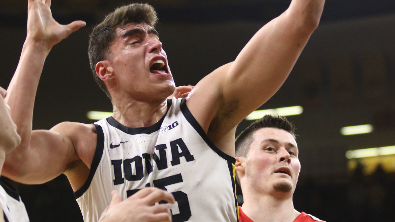 IOWA CITY, IOWA- FEBRUARY 20: Forward Luka Garza #55 of the Iowa Hawkeyes grabs a rebound in the first half from forward Kyle Young #25 of the Ohio State Buckeyes at Carver-Hawkeye Arena on February 20, 2020 in Iowa City, Iowa.