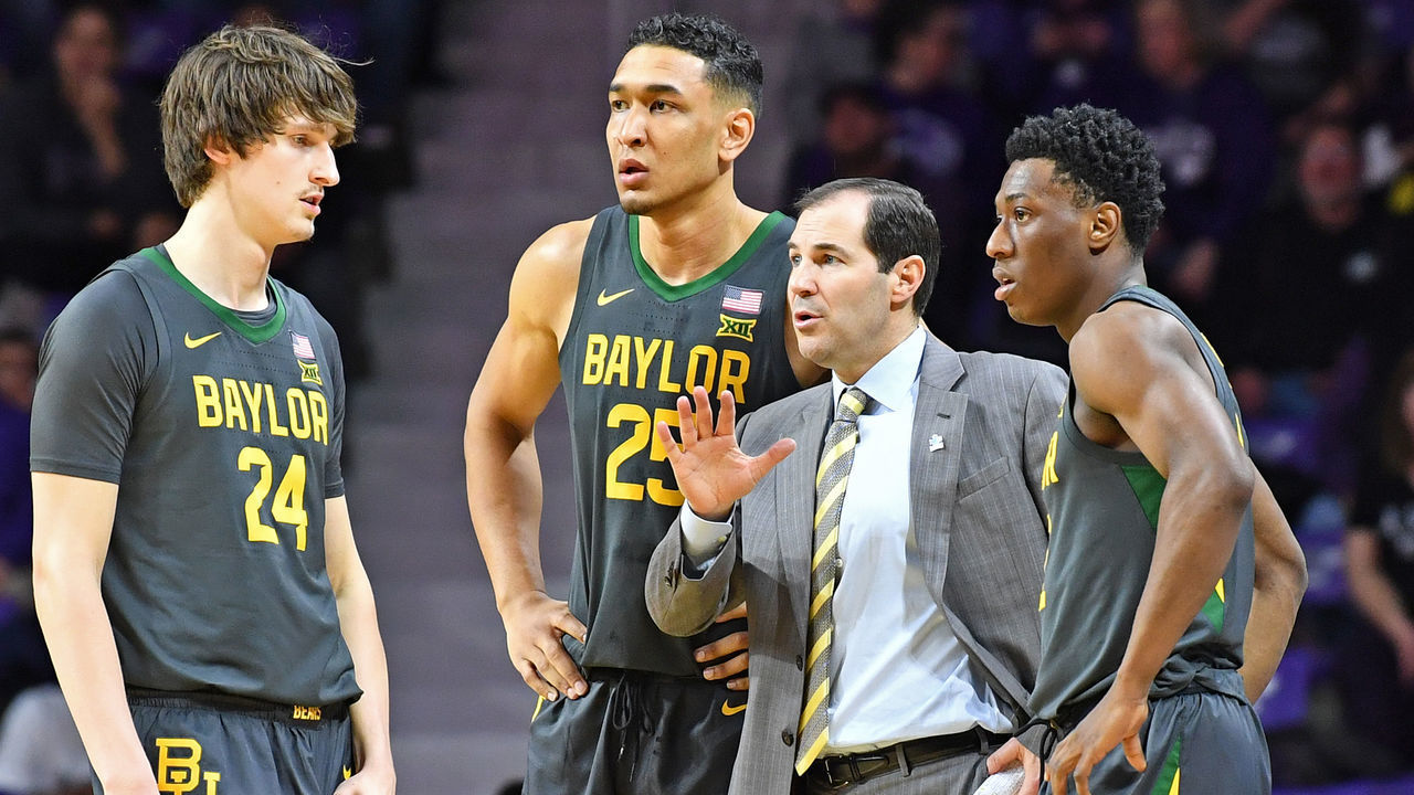 MANHATTAN, KS - FEBRUARY 03: Head coach Scott Drew of the Baylor Bears talks with players Devonte Bandoo #2, Tristan Clark #25 and Matthew Mayer #24, during the first half against the Kansas State Wildcats at Bramlage Coliseum on February 3, 2020 in Manhattan, Kansas.