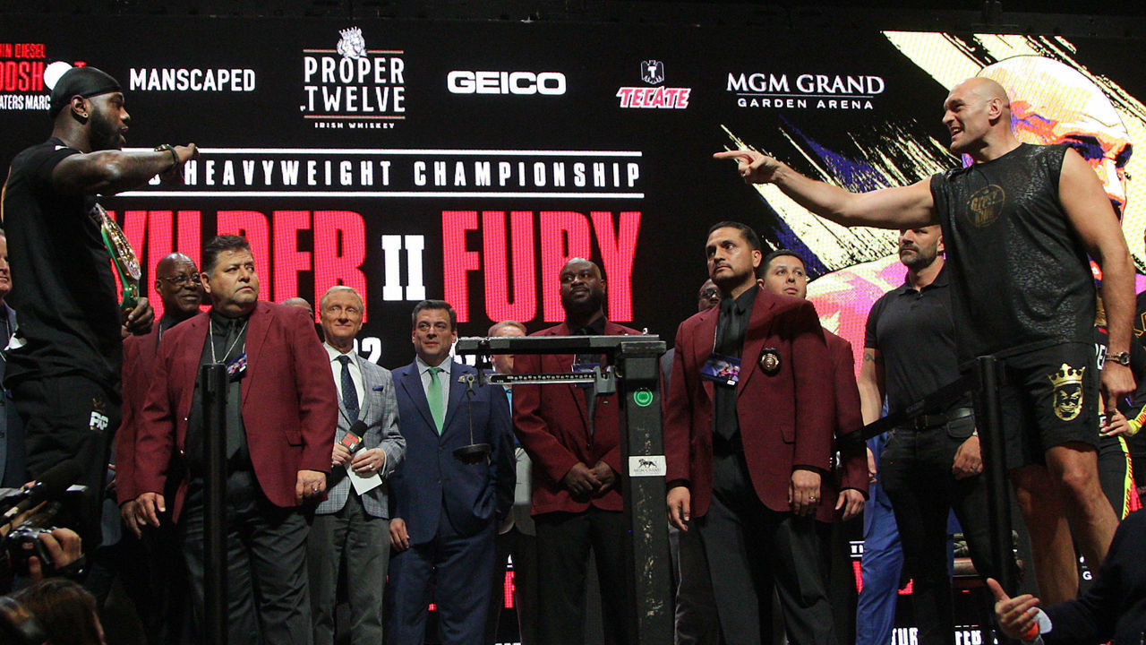 US boxer Deontay Wilder (L) and British boxer Tyson Fury (R) face off during their official weigh-in at the MGM Grand Las Vegas in Las Vegas, Nevada on February 21, 2020. - The boxers will fight for the World Boxing Council (WBC) Heavyweight Championship Title on February 22, 2020 at the MGM Grand Garden Arena in Las Vegas.
