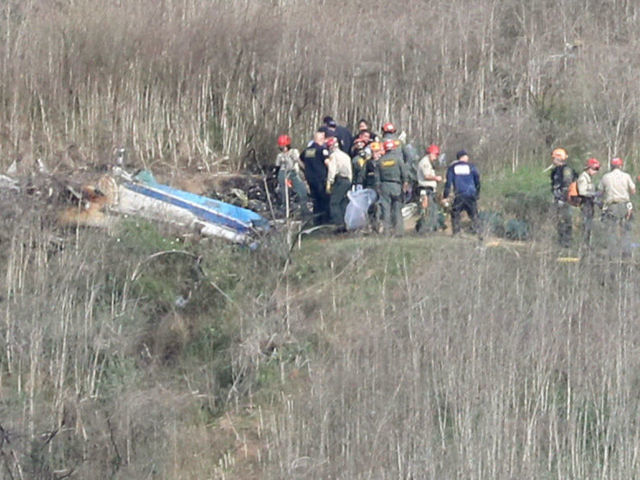 CALABASAS, CALIFORNIA - JANUARY 27: Emergency personnel work at the helicopter crash site that claimed the life of former NBA great Kobe Bryant on January 27, 2020 in Calabasas, California. Bryant, 41, his daughter Gianna, 13, and seven others perished in the accident yesterday.
