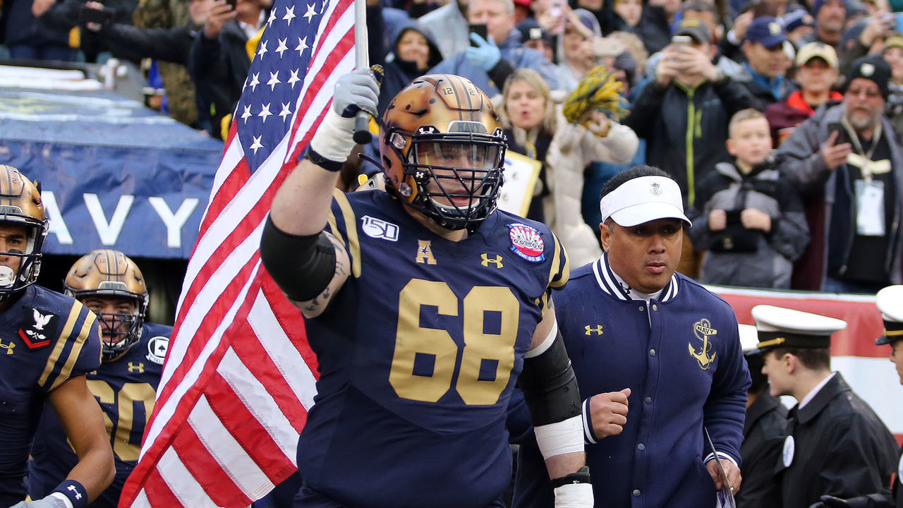 PHILADELPHIA, PA - DECEMBER 14: Navy Midshipmen guard David Forney (68) leads out his team before a college football game between the Army Black Knights and the Navy Midshipmen on December 14, 2019, at Lincoln Financial Field in Philadelphia, PA.