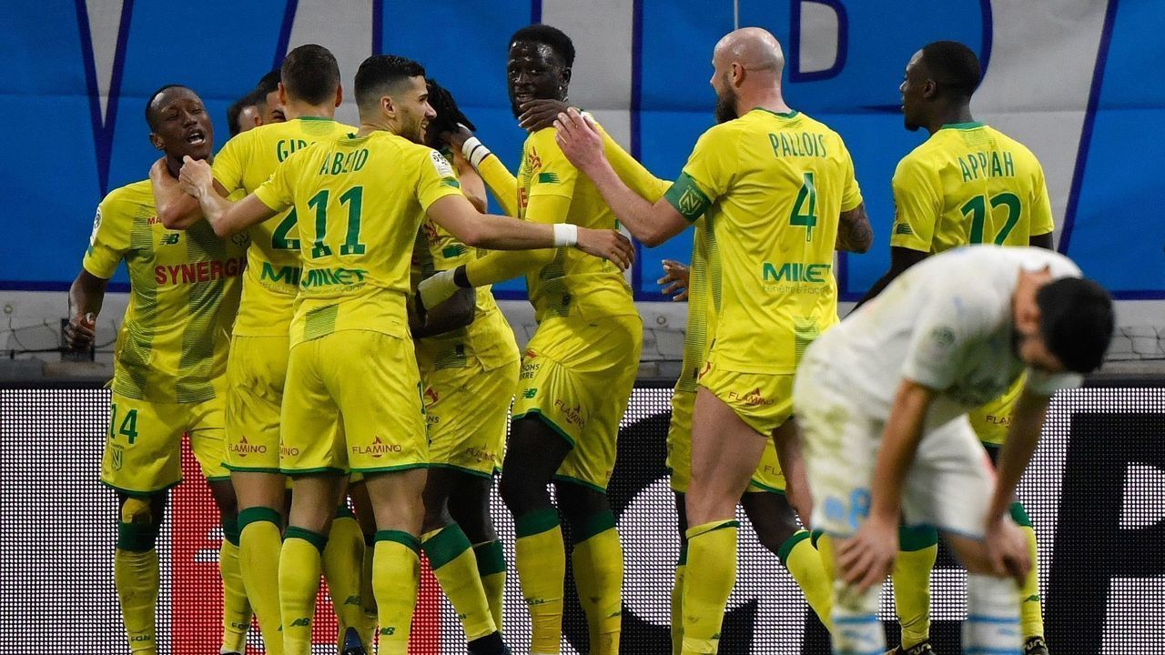 Nantes' players celebrate scoring their third goal during the French L1 football match between Olympique de Marseille (OM) and Football Club de Nantes (FCN) at the Velodrome Stadium in Marseille, southern France, on February 22, 2020.