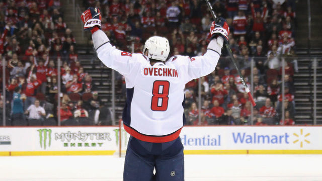 NEWARK, NEW JERSEY - FEBRUARY 22: Alex Ovechkin #8 of the Washington Capitals celebrates his goal at 4:50 of the third period against the New Jersey Devils at the Prudential Center on February 22, 2020 in Newark, New Jersey. With the goal, Ovechkin became the eight player in NHL history to score 700 goals.