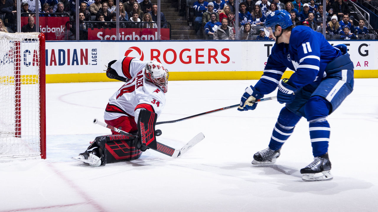 TORONTO, ON - FEBRUARY 22: Zach Hyman #11 of the Toronto Maple Leafs shoots the puck against Petr Mrazek #34 of the Carolina Hurricanes during the first period at the Scotiabank Arena on February 22, 2020 in Toronto, Ontario, Canada.