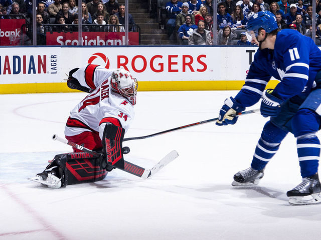 TORONTO, ON - FEBRUARY 22: Zach Hyman #11 of the Toronto Maple Leafs shoots the puck against Petr Mrazek #34 of the Carolina Hurricanes during the first period at the Scotiabank Arena on February 22, 2020 in Toronto, Ontario, Canada.