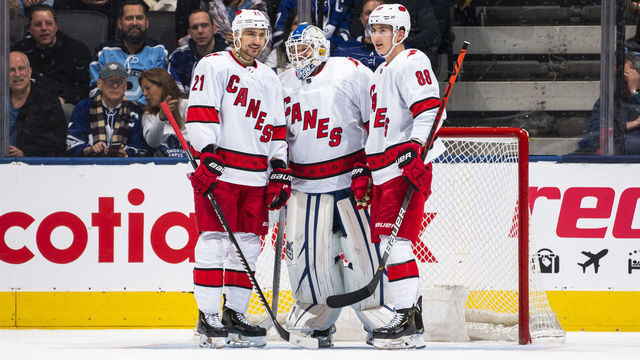 TORONTO, ON - FEBRUARY 22: Nino Niederreiter #21 and Martin Necas #88 of the Carolina Hurricanes talk with emergency backup goaltender Dave Ayres #90 during the second period against the Toronto Maple Leafs at the Scotiabank Arena on February 22, 2020 in Toronto, Ontario, Canada.