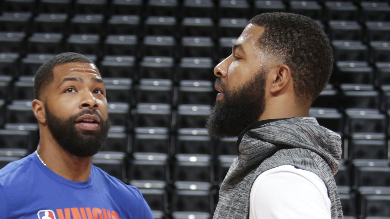 DETROIT, MI - NOVEMBER 6: Marcus Morris Sr. #13 of the New York Knicks with his brother Markieff Morris #8 of the Detroit Pistons during pre-game on November 6, 2019 at Little Caesars Arena in Detroit, Michigan. NOTE TO USER: User expressly acknowledges and agrees that, by downloading and/or using this photograph, User is consenting to the terms and conditions of the Getty Images License Agreement. Mandatory Copyright Notice: Copyright 2019 NBAE