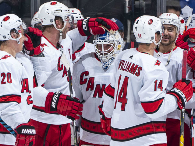 TORONTO, ON - FEBRUARY 22: Emergency backup goaltender Dave Ayres #90 of the Carolina Hurricanes celebrates with teammates after defeating the Toronto Maple Leafs at the Scotiabank Arena on February 22, 2020 in Toronto, Ontario, Canada.