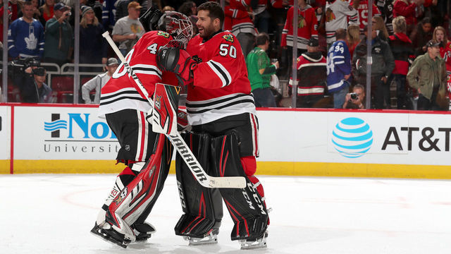 CHICAGO, IL - NOVEMBER 10: Goalies Robin Lehner #40 and Corey Crawford #50 of the Chicago Blackhawks celebrate after defeating the Toronto Maple Leafs 5-4 at the United Center on November 10, 2019 in Chicago, Illinois.