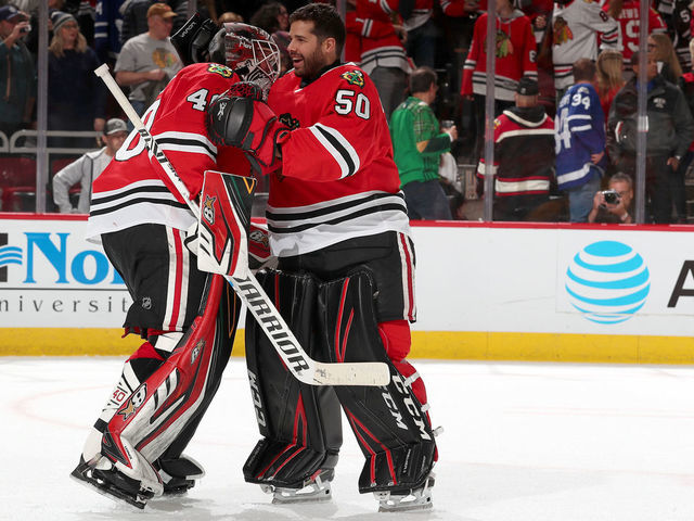 CHICAGO, IL - NOVEMBER 10: Goalies Robin Lehner #40 and Corey Crawford #50 of the Chicago Blackhawks celebrate after defeating the Toronto Maple Leafs 5-4 at the United Center on November 10, 2019 in Chicago, Illinois.