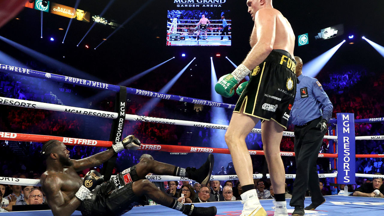 LAS VEGAS, NEVADA - FEBRUARY 22: Tyson Fury knocks down Deontay Wilder during their Heavyweight bout for Wilder's WBC and Fury's lineal heavyweight title on February 22, 2020 at MGM Grand Garden Arena in Las Vegas, Nevada.