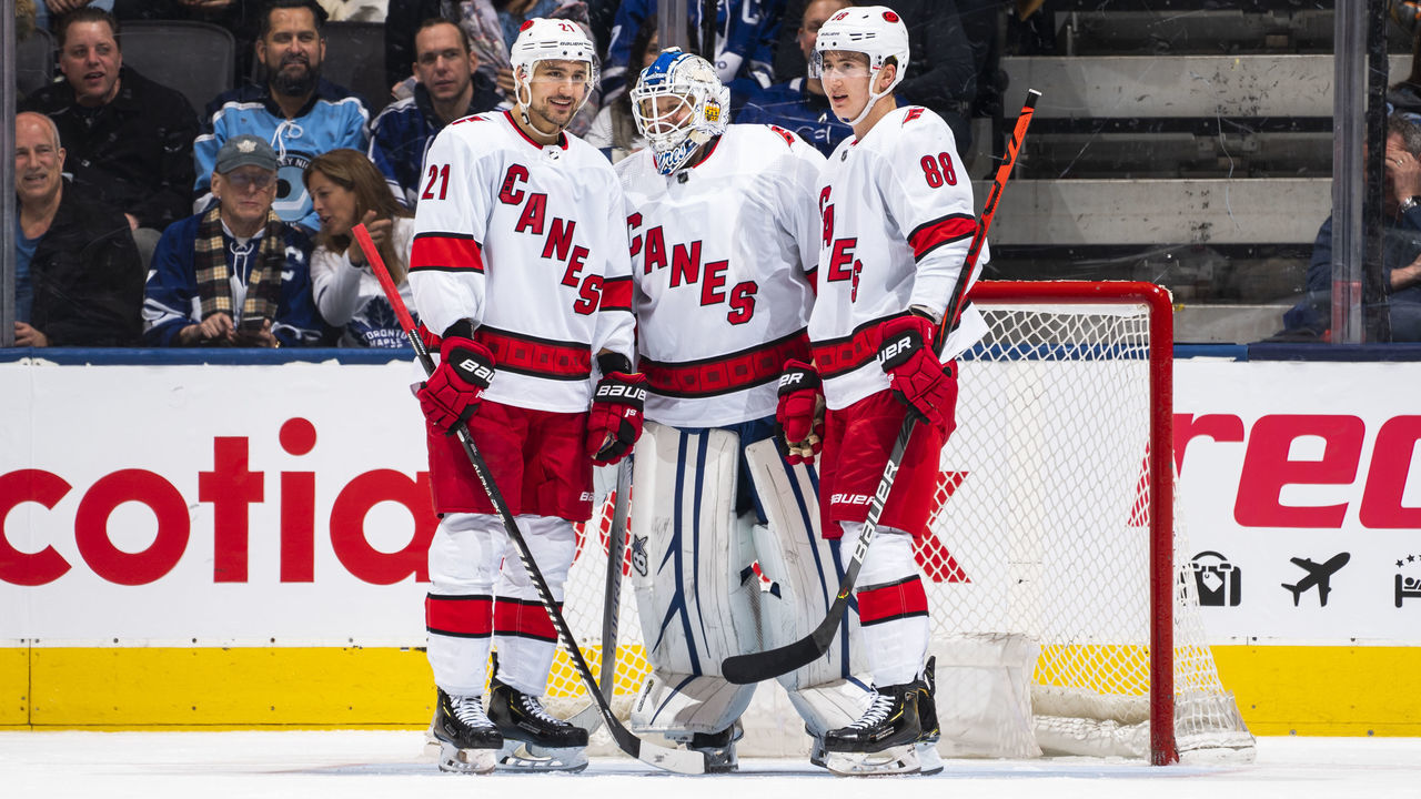 TORONTO, ON - FEBRUARY 22: Nino Niederreiter #21 and Martin Necas #88 of the Carolina Hurricanes talk with emergency backup goaltender Dave Ayres #90 during the second period against the Toronto Maple Leafs at the Scotiabank Arena on February 22, 2020 in Toronto, Ontario, Canada.