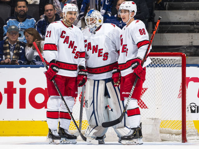 TORONTO, ON - FEBRUARY 22: Nino Niederreiter #21 and Martin Necas #88 of the Carolina Hurricanes talk with emergency backup goaltender Dave Ayres #90 during the second period against the Toronto Maple Leafs at the Scotiabank Arena on February 22, 2020 in Toronto, Ontario, Canada.