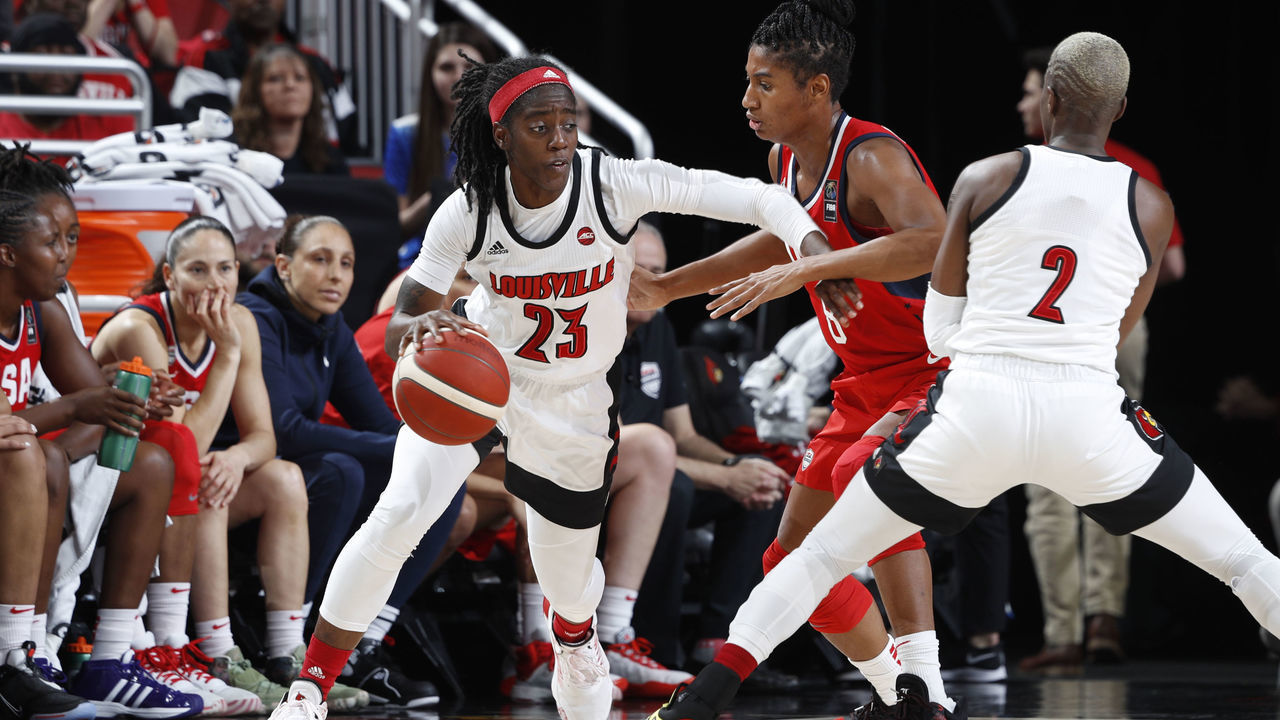 LOUISVILLE, KY - FEBRUARY 02: Jazmine Jones #23 of the Louisville Cardinals handles the basketball during an exhibition game against the USA Women's National team at KFC YUM! Center on February 2, 2020 in Louisville, Kentucky.