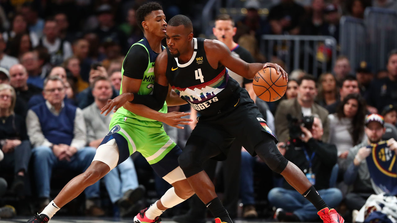 DENVER, CO - FEBRUARY 23: Paul Millsap #4 of the Denver Nuggets is guarded by Jarrett Culver #23 of the Minnesota Timberwolves at Pepsi Center on February 23, 2020 in Denver, Colorado.
