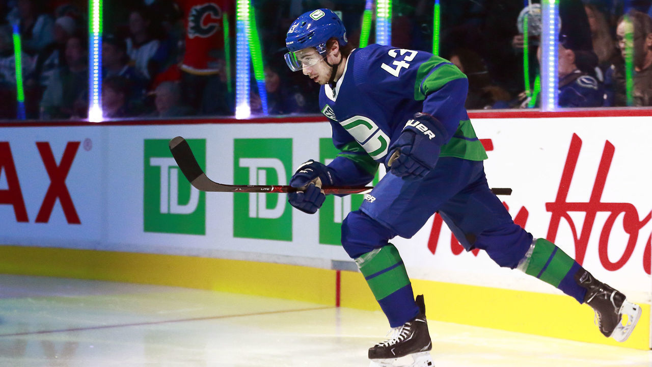 VANCOUVER, BC - FEBRUARY 8: Quinn Hughes #43 of the Vancouver Canucks skates onto ice during their NHL game against the Calgary Flames at Rogers Arena February 8, 2020 in Vancouver, British Columbia, Canada. "n