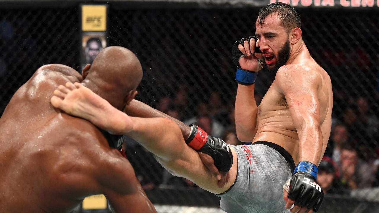 HOUSTON, TEXAS - FEBRUARY 08: (R-L) Dominick Reyes kicks Jon Jones in their light heavyweight championship bout during the UFC 247 event at Toyota Center on February 08, 2020 in Houston, Texas.