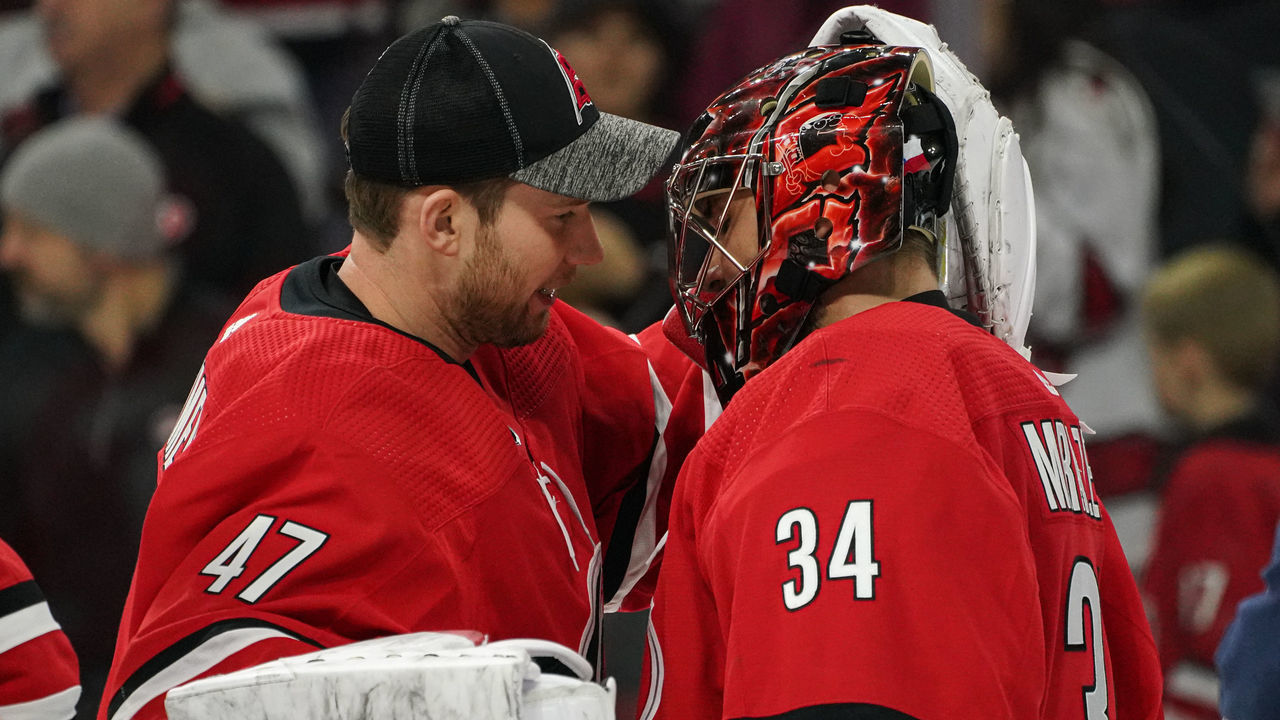 RALEIGH, NC - JANUARY 21: Carolina Hurricanes Goalie James Reimer (47) congratulates Carolina Hurricanes Goalie Petr Mrazek (34) after a game between the Carolina Hurricanes and the Winnipeg Jets on January 21, 2020 at the PNC Arena in Raleigh, NC.