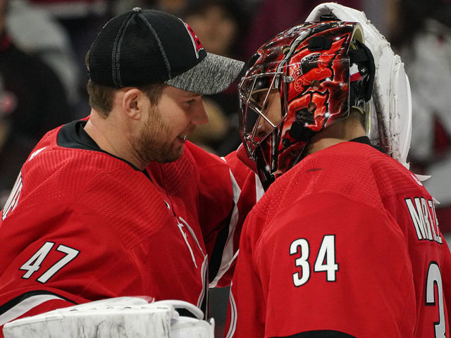 RALEIGH, NC - JANUARY 21: Carolina Hurricanes Goalie James Reimer (47) congratulates Carolina Hurricanes Goalie Petr Mrazek (34) after a game between the Carolina Hurricanes and the Winnipeg Jets on January 21, 2020 at the PNC Arena in Raleigh, NC.
