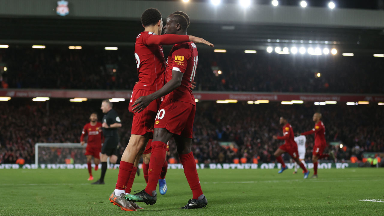LIVERPOOL, ENGLAND - FEBRUARY 24: Sadio Mané of Liverpool celebrates after scoring his sides third goal with Trent Alexander-Arnold of Liverpool during the Premier League match between Liverpool FC and West Ham United at Anfield on February 24, 2020 in Liverpool, United Kingdom.