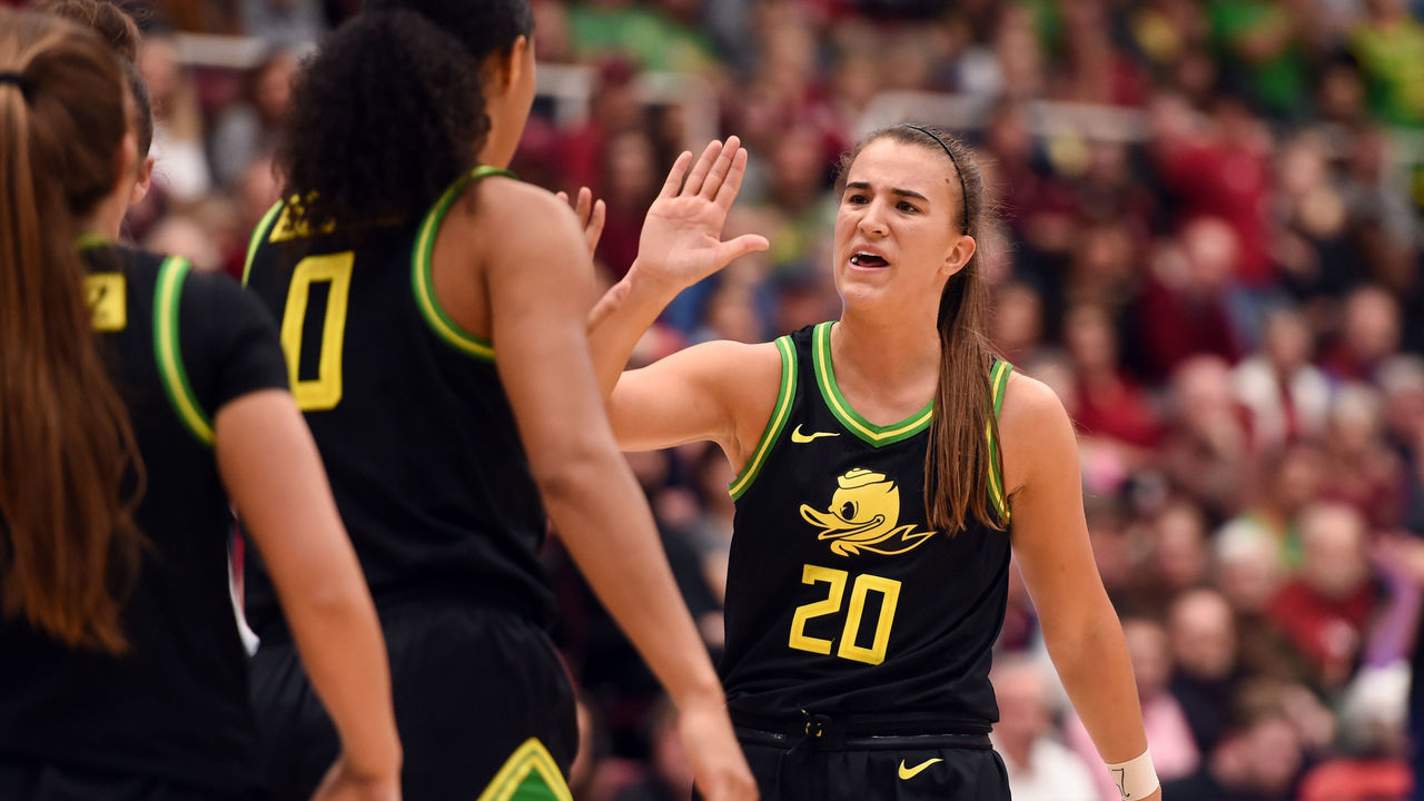 PALO ALTO, CA - FEBRUARY 24: Oregon Ducks guard Sabrina Ionescu (20) celebrates with teammate Oregon Ducks forward Satou Sabally (0) during the NCAA women's basketball game between the Oregon Ducks and the Stanford Cardinal at Maples Pavilion on February 24, 2020 in Palo Alto, CA.