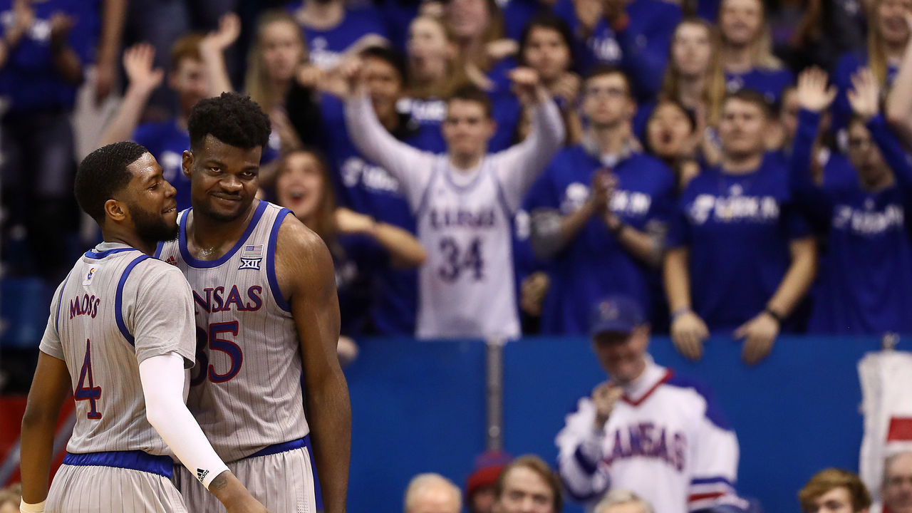 LAWRENCE, KANSAS - FEBRUARY 24: Udoka Azubuike #35 of the Kansas Jayhawks smiles with Isaiah Moss #4 after being fouled during the game against the Oklahoma State Cowboys at Allen Fieldhouse on February 24, 2020 in Lawrence, Kansas.