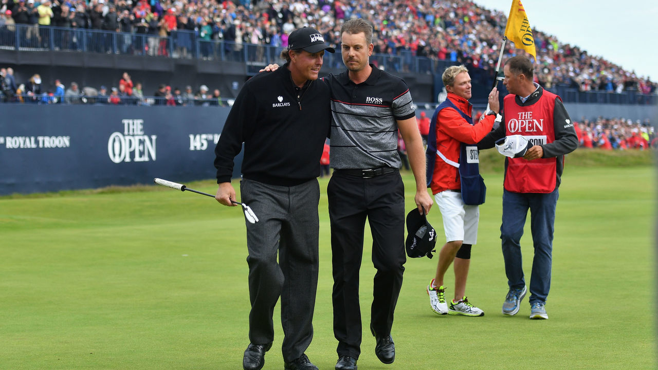 TROON, SCOTLAND - JULY 17: Henrik Stenson of Sweden is congratulated on his victory by Phil Mickelson of the United States (R) on the 18th green during the final round on day four of the 145th Open Championship at Royal Troon on July 17, 2016 in Troon, Scotland.