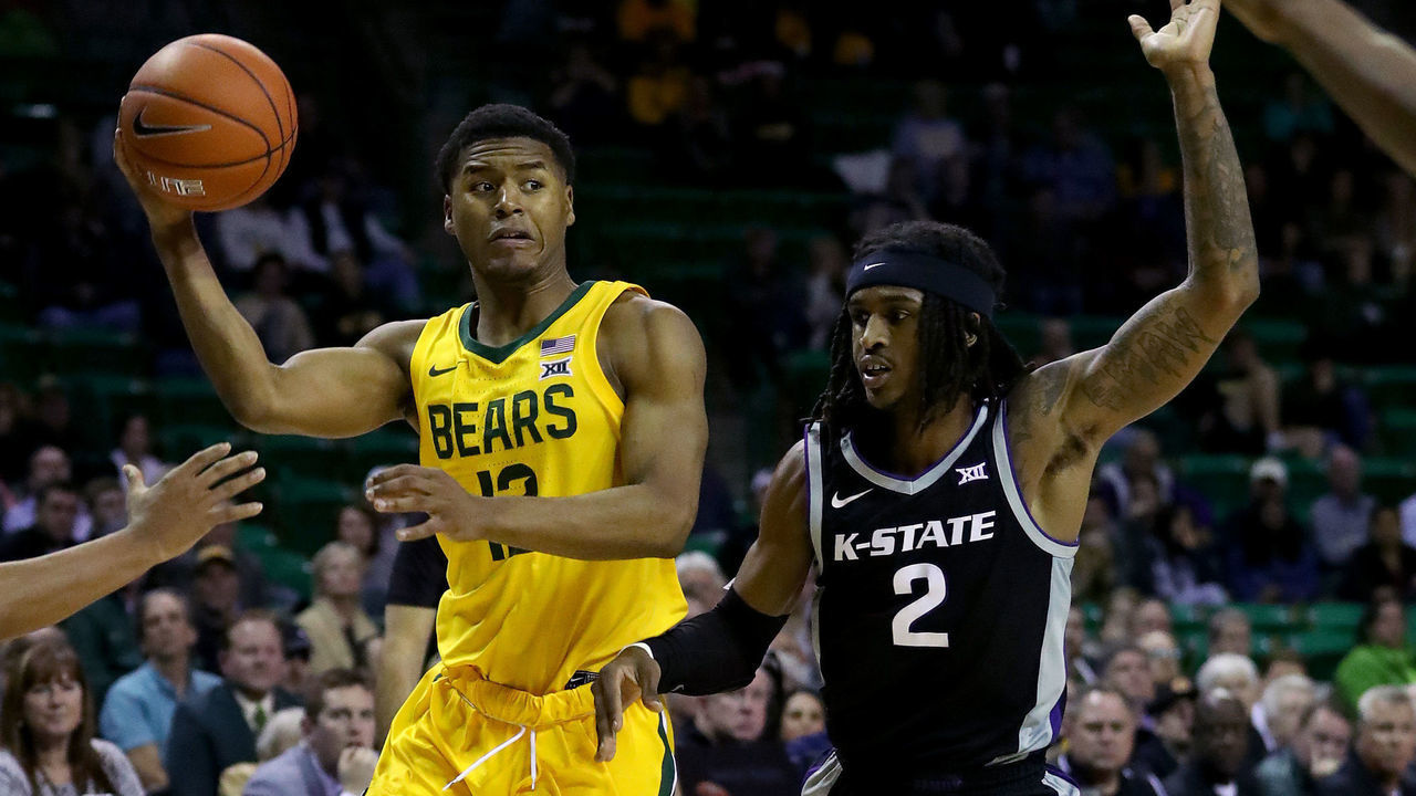 WACO, TEXAS - FEBRUARY 25: Jared Butler #12 of the Baylor Bears passes the ball against Cartier Diarra #2 of the Kansas State Wildcats in the second half of a NCAA basketball game at Ferrell Center on February 25, 2020 in Waco, Texas.