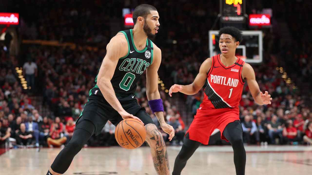PORTLAND, OREGON - FEBRUARY 25: Jayson Tatum #0 of the Boston Celtics dribbles with the ball against Anfernee Simons #1 of the Portland Trail Blazers in the second quarter during their game at Moda Center on February 25, 2020 in Portland, Oregon.