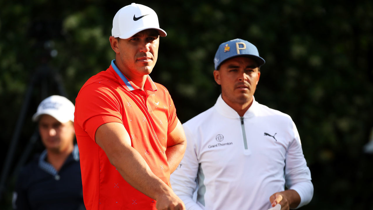 PONTE VEDRA BEACH, FLORIDA - MARCH 15: (from left) Brooks Koepka of the United States and Rickie Fowler of the United States look on during the second round of The PLAYERS Championship on The Stadium Course at TPC Sawgrass on March 15, 2019 in Ponte Vedra Beach, Florida.