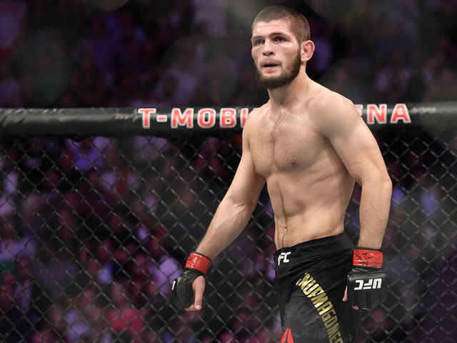 LAS VEGAS, NV - OCTOBER 06: Khabib Nurmagomedov of Russia stares across at Conor McGregor of Ireland in their UFC lightweight championship bout during the UFC 229 event inside T-Mobile Arena on October 6, 2018 in Las Vegas, Nevada.