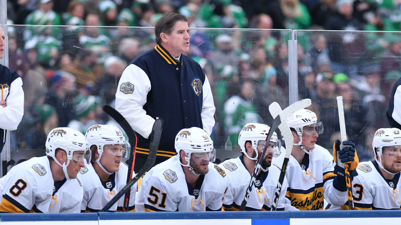 DALLAS, TX - JANUARY 1: Peter Laviolette of the Nashville Predators watches the action from the bench during the 2020 NHL Winter Classic between the Nashville Predators and the Dallas Stars at The Cotton Bowl on January 1, 2020 in Dallas, Texas.