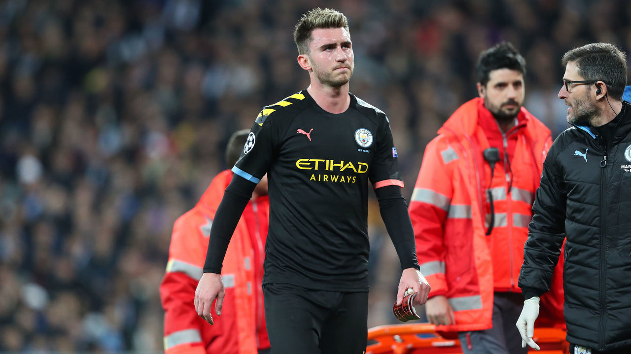 MADRID, SPAIN - FEBRUARY 26: Aymeric Laporte of Manchester City goes off injured during the UEFA Champions League round of 16 first leg match between Real Madrid and Manchester City at Bernabeu on February 26, 2020 in Madrid, Spain.