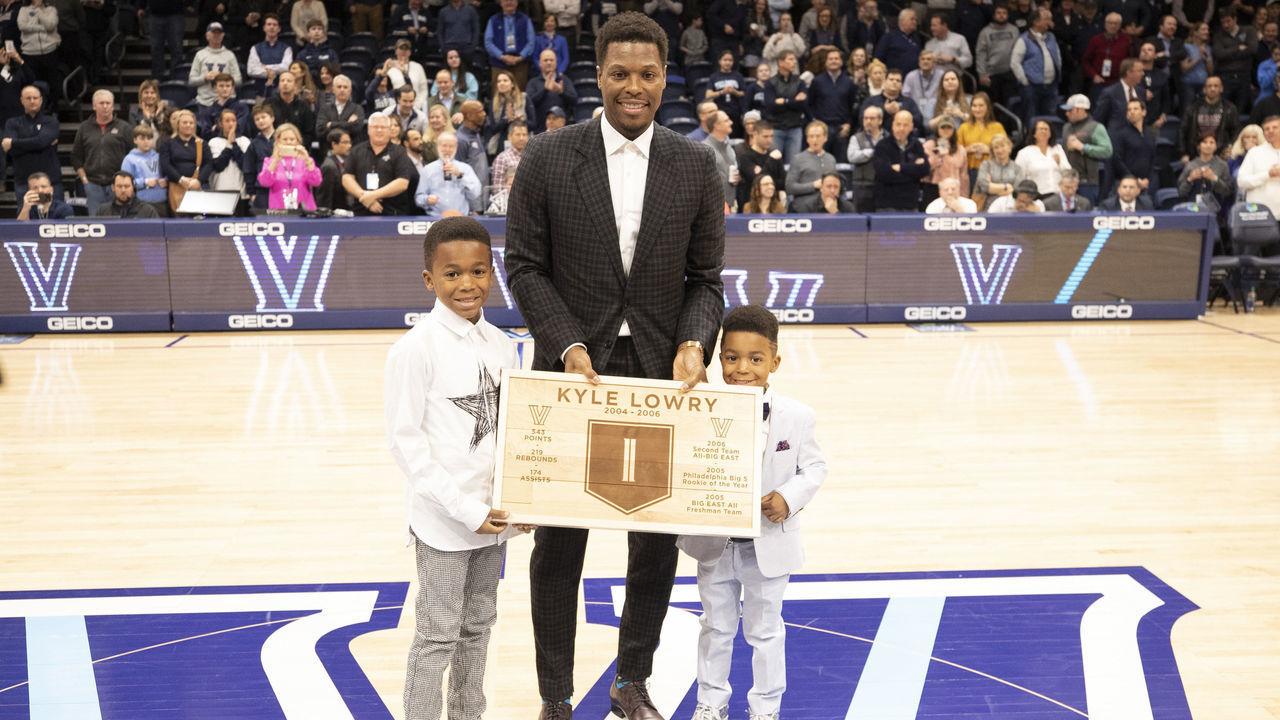 VILLANOVA, PA - FEBRUARY 26: Former Villanova Wildcats guard Kyle Lowry poses for a picture with his sons Karter and Kameron after getting his number retired during halftime of the game against the St. John's Red Storm at Finneran Pavilion on February 26, 2020 in Villanova, Pennsylvania. The Villanova Wildcats defeated the St. John's Red Storm 71-60.