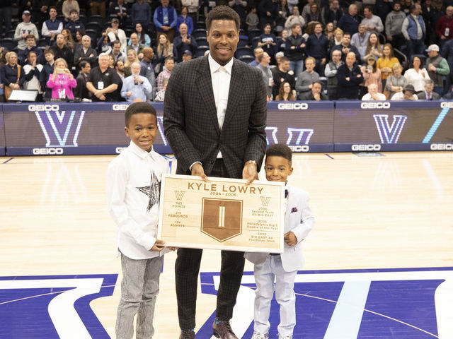 VILLANOVA, PA - FEBRUARY 26: Former Villanova Wildcats guard Kyle Lowry poses for a picture with his sons Karter and Kameron after getting his number retired during halftime of the game against the St. John's Red Storm at Finneran Pavilion on February 26, 2020 in Villanova, Pennsylvania. The Villanova Wildcats defeated the St. John's Red Storm 71-60.