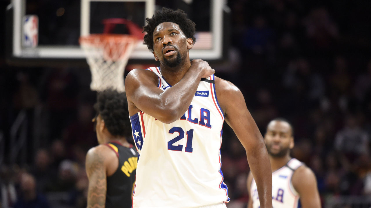 CLEVELAND, OHIO - FEBRUARY 26: Joel Embiid #21 of the Philadelphia 76ers reacts after an injury during the first half against the Cleveland Cavaliers at Rocket Mortgage Fieldhouse on February 26, 2020 in Cleveland, Ohio. NOTE TO USER: User expressly acknowledges and agrees that, by downloading and/or using this photograph, user is consenting to the terms and conditions of the Getty Images License Agreement.