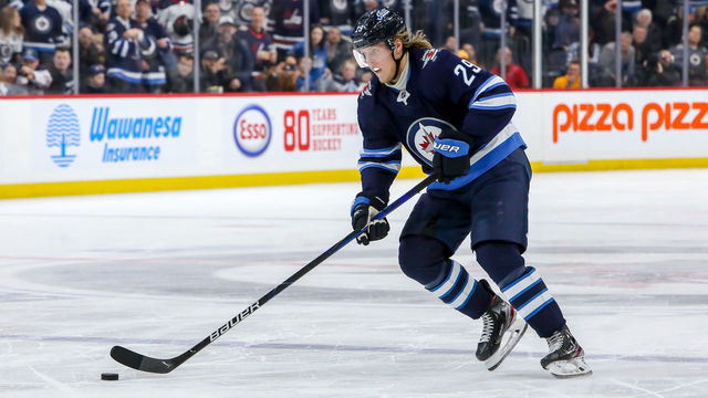 WINNIPEG, MB - FEBRUARY 4: Patrik Laine #29 of the Winnipeg Jets carries the puck down the ice during a second period penalty shot against the Nashville Predators at the Bell MTS Place on February 4, 2020 in Winnipeg, Manitoba, Canada. The Preds defeated the Jets 2-1 in overtime.