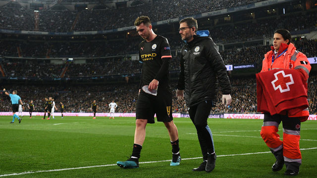 MADRID, SPAIN - FEBRUARY 26: Aymeric Laporte of Manchester City leaves the pitch due to injury during the UEFA Champions League round of 16 first leg match between Real Madrid and Manchester City at Bernabeu on February 26, 2020 in Madrid, Spain.