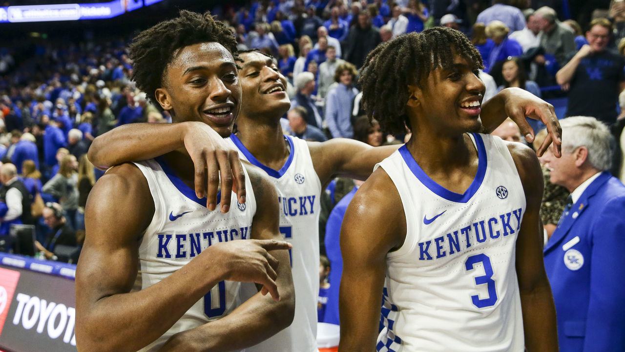 LEXINGTON, KENTUCKY - FEBRUARY 22: Ashton Hagans #0, Immanuel Quickley #5 and Tyrese Maxey #3 of the Kentucky Wildcats celebrate defeating the Florida Gators 65-59 after the game at Rupp Arena on February 22, 2020 in Lexington, Kentucky.